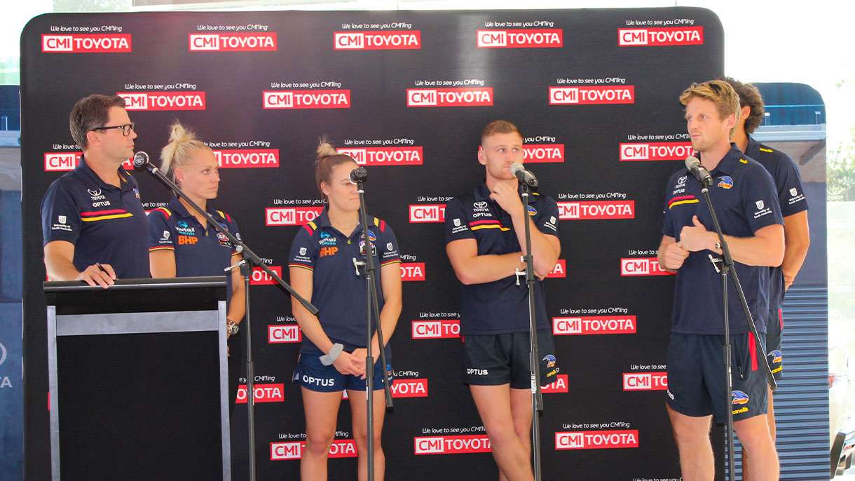Adelaide Crows players on stage