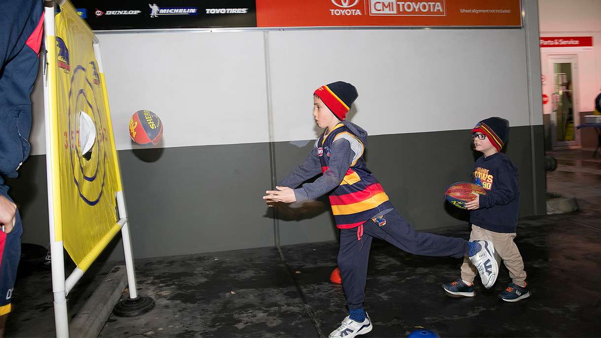 Kids playing football at Crows family BBQ 2017