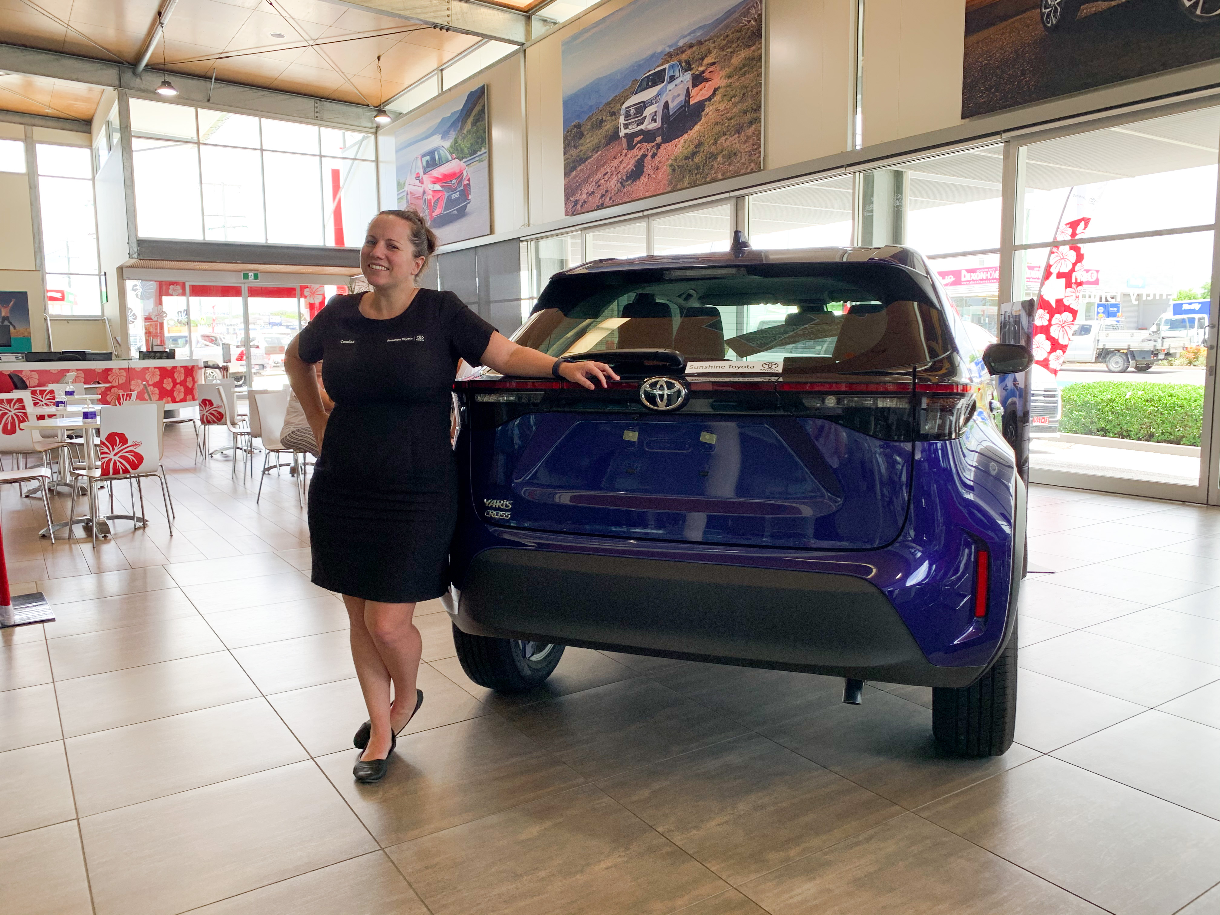 Candice with blue Yaris Cross - ask us today at Sunshine Toyota on the Sunshine Coast